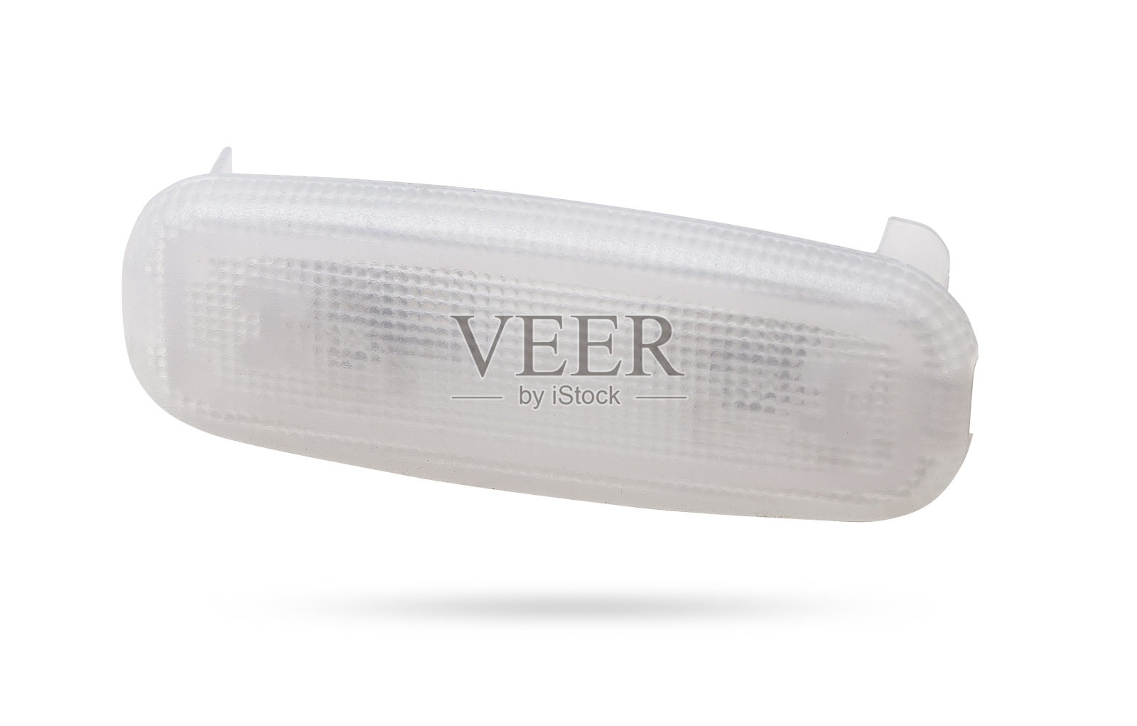 照相馆白色隔离背景上用于照亮内部的透明塑料遮光罩——用于修理汽车内部或在汽车服务中出售的备件。照片摄影图片