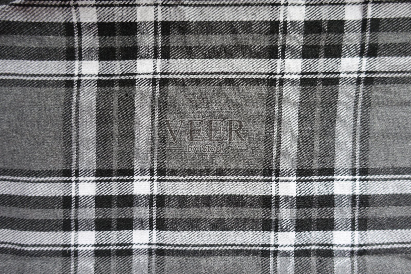 表面为灰色、黑白棉法兰绒格子面料照片摄影图片
