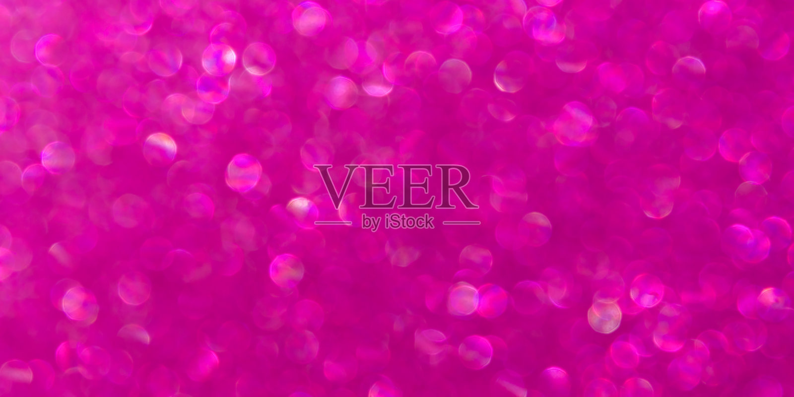 抽象的粉色洋红色背景与未聚焦的散景。照片摄影图片