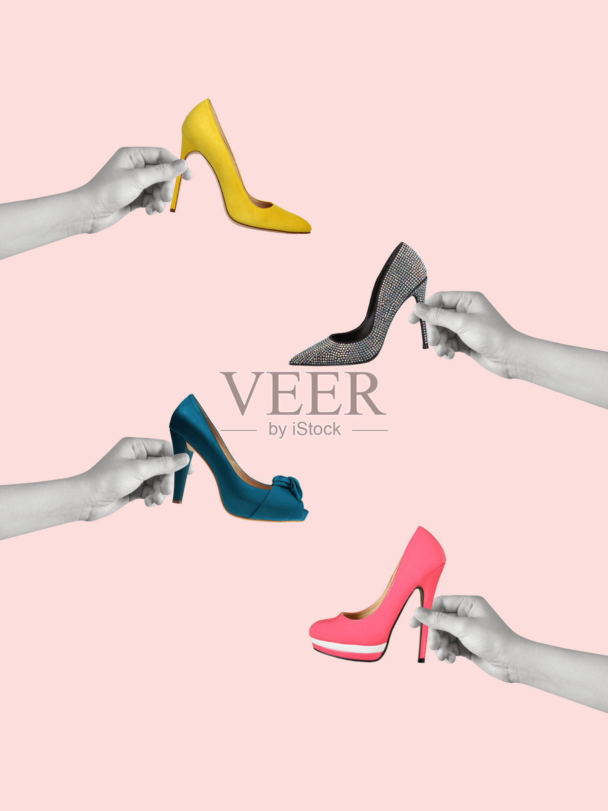 当代艺术拼贴手高跟鞋。照片摄影图片