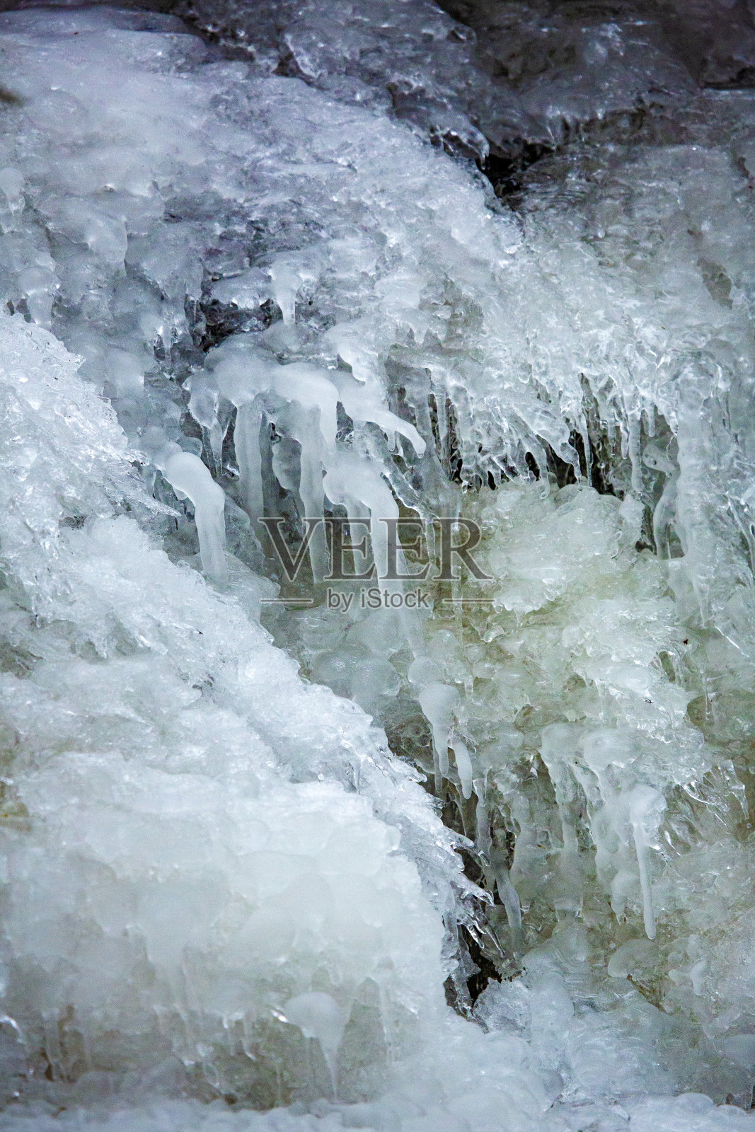 康乃狄克州冰冻瀑布中五彩缤纷的冰瀑。照片摄影图片