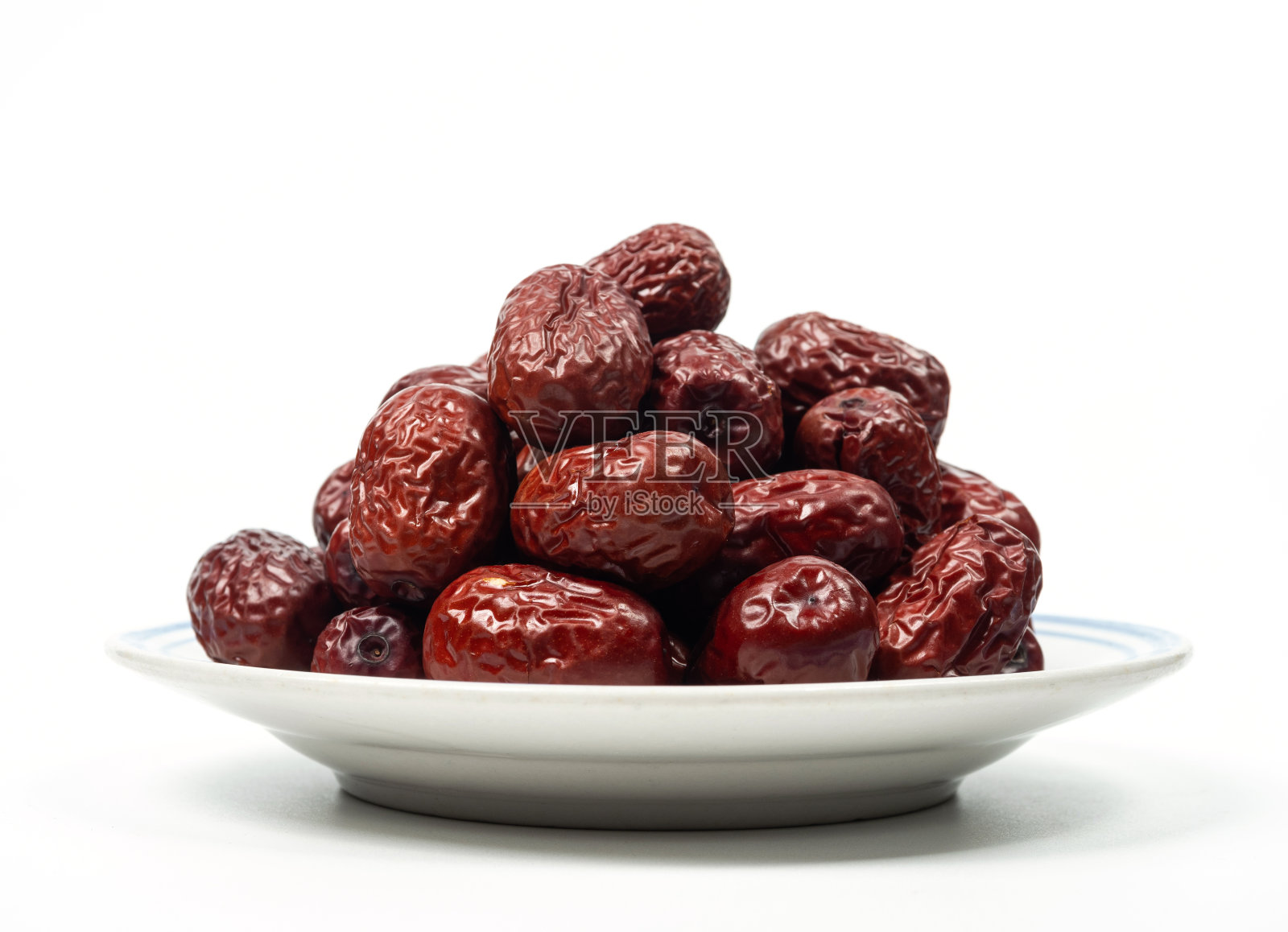 白色背景上的红枣均匀旋转照片摄影图片