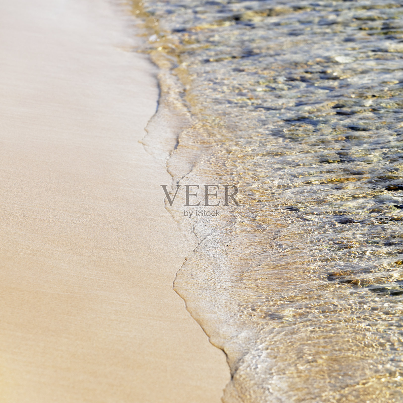 沙子和海浪照片摄影图片