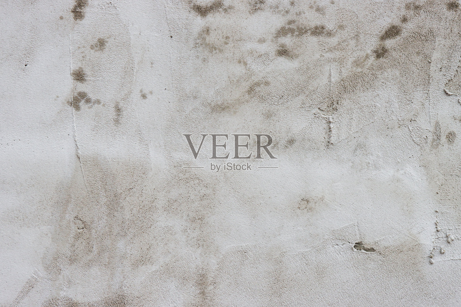 墙壁上覆盖着粗糙的腻子。照片摄影图片