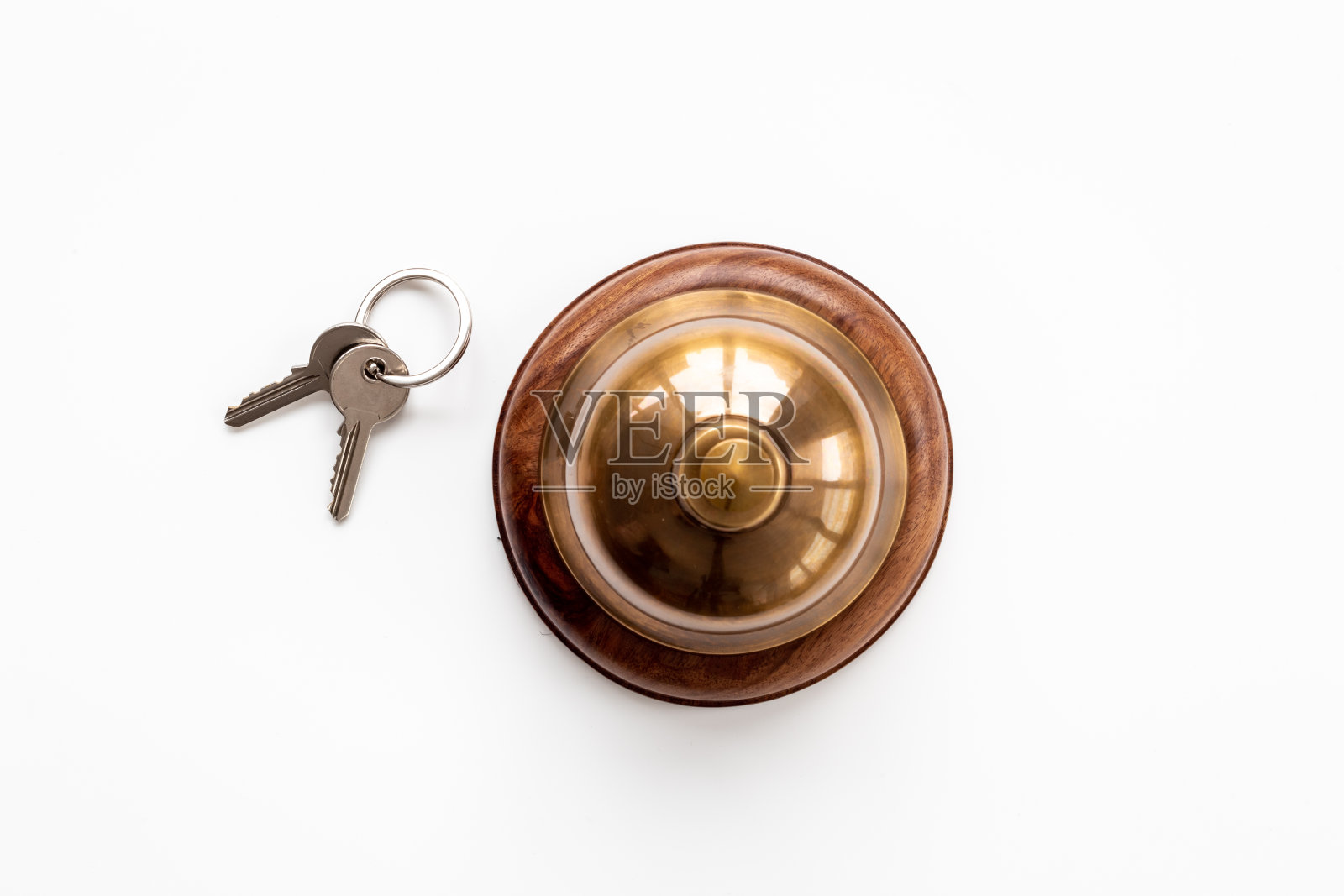 金色酒店服务钟和钥匙在前台照片摄影图片