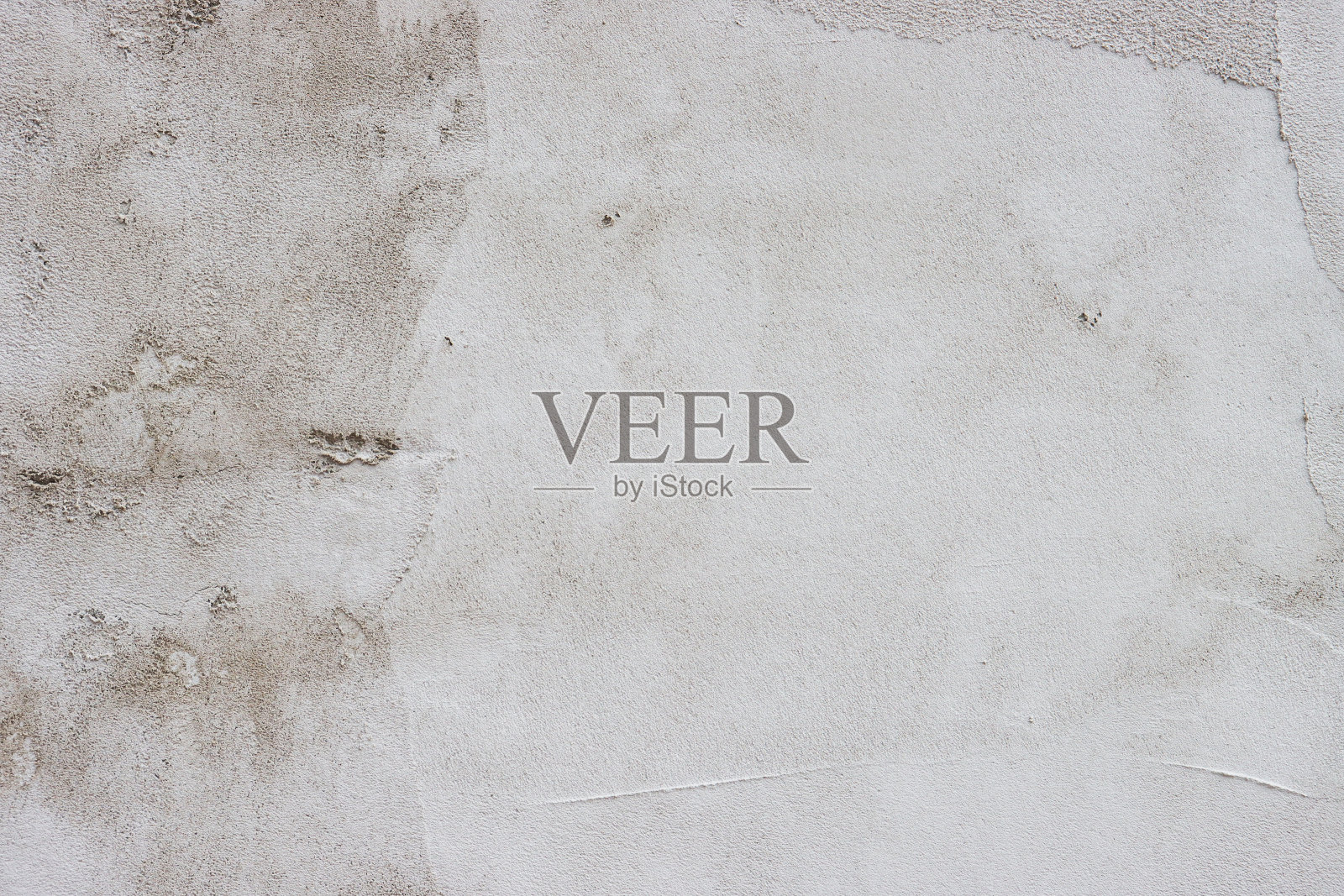 墙壁上覆盖着粗糙的腻子。照片摄影图片