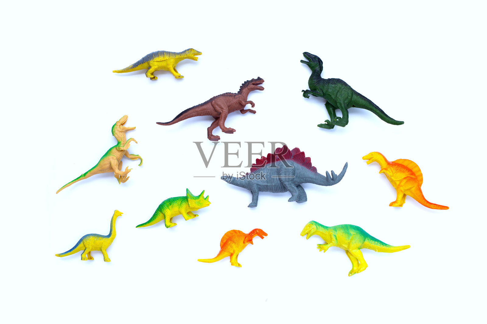 白色背景的塑料恐龙玩具。俯视图照片摄影图片