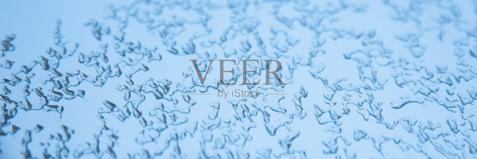 抽象的蓝色背景。结冰的水，冰的质地照片摄影图片