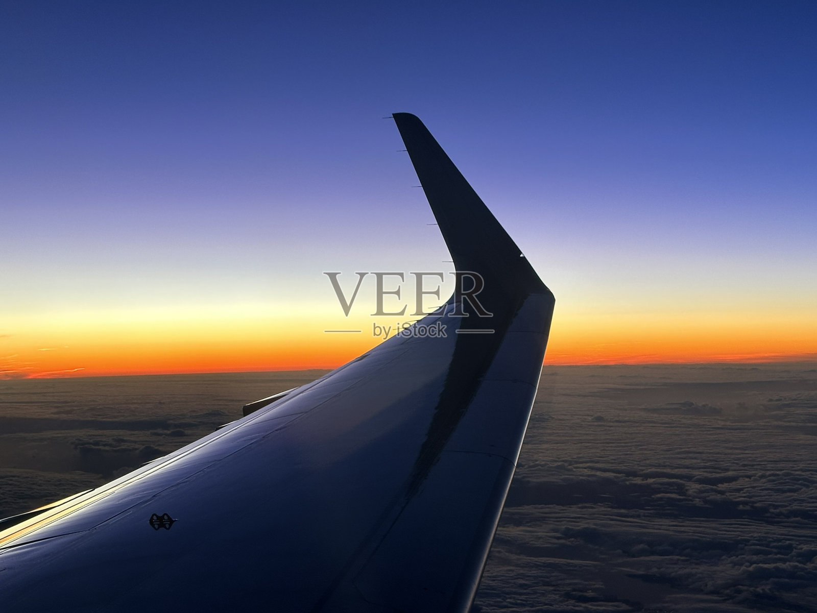 从飞机上看日落照片摄影图片