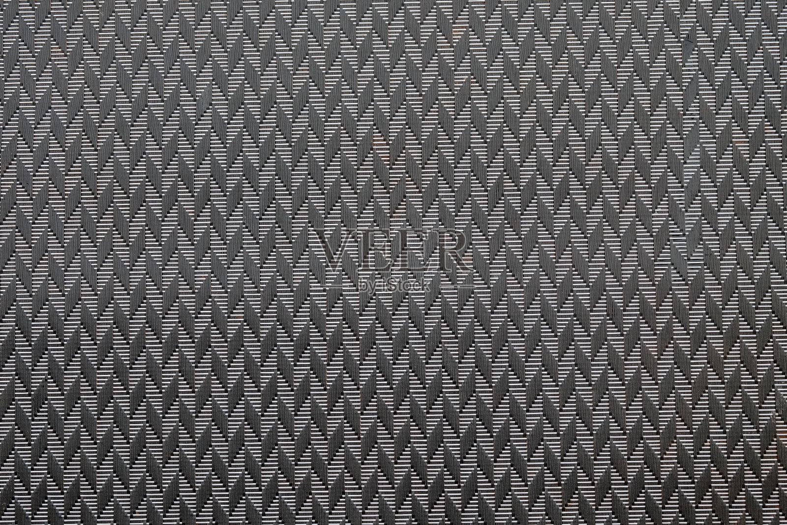 黑色垫子纹理背景。盘子垫的背景。照片摄影图片