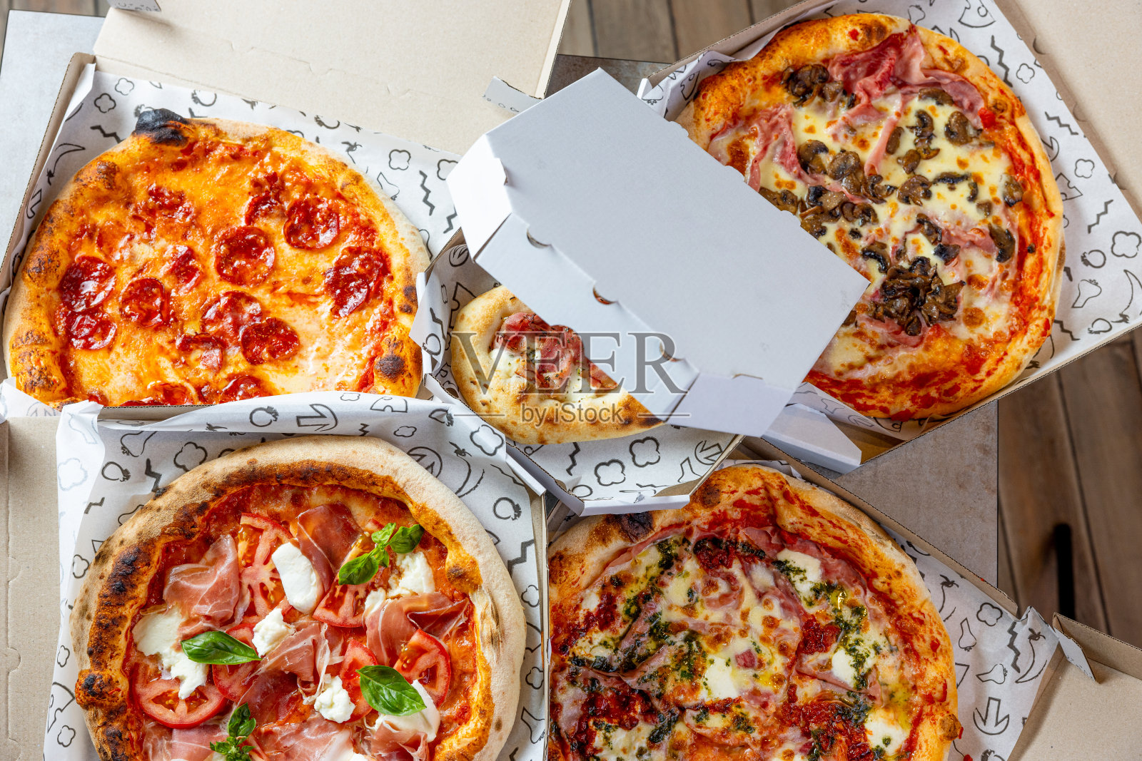 披萨外卖，各种各样的开箱披萨照片摄影图片