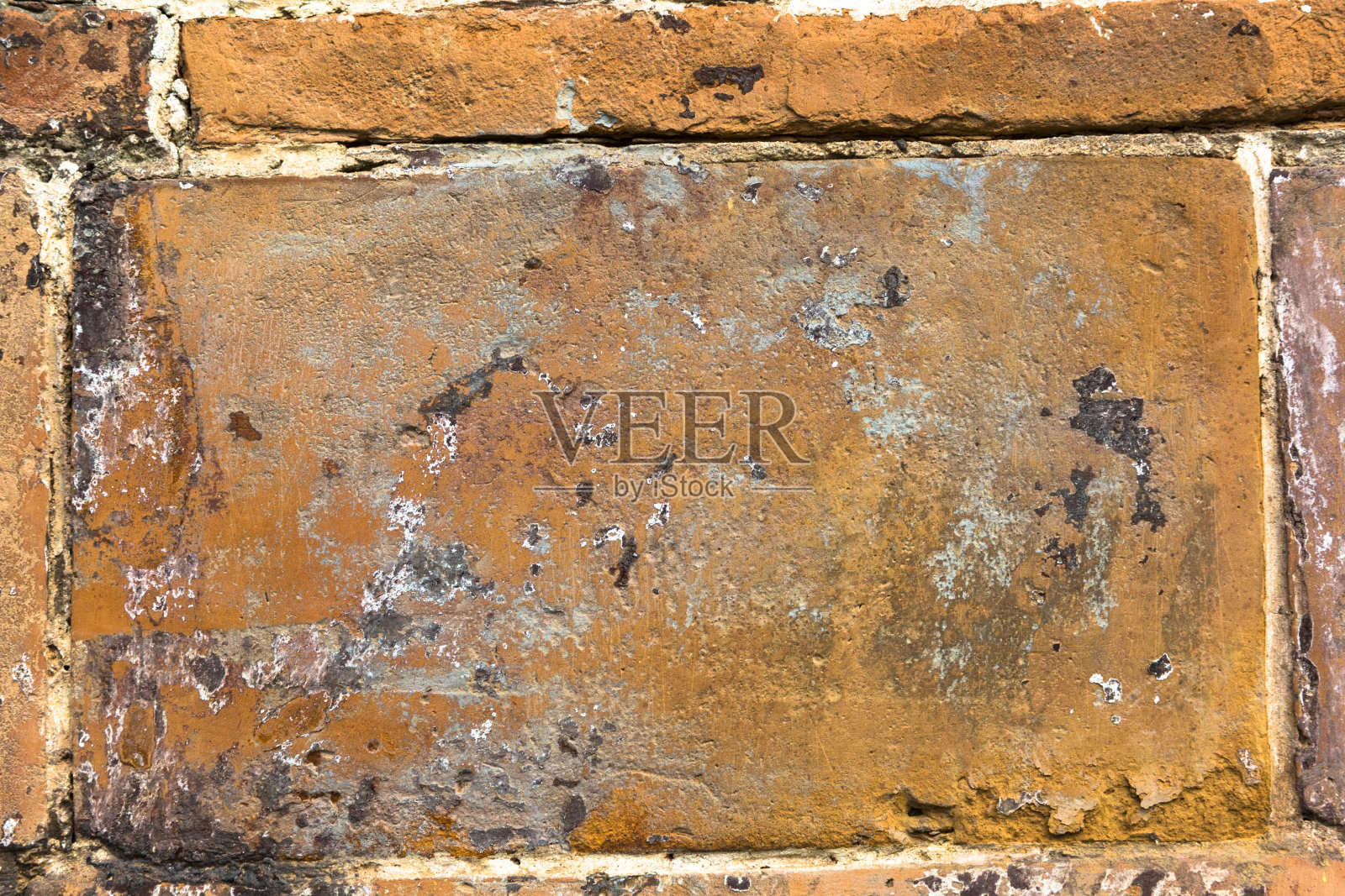 古老而风化的红墙。石头图案背景。照片摄影图片