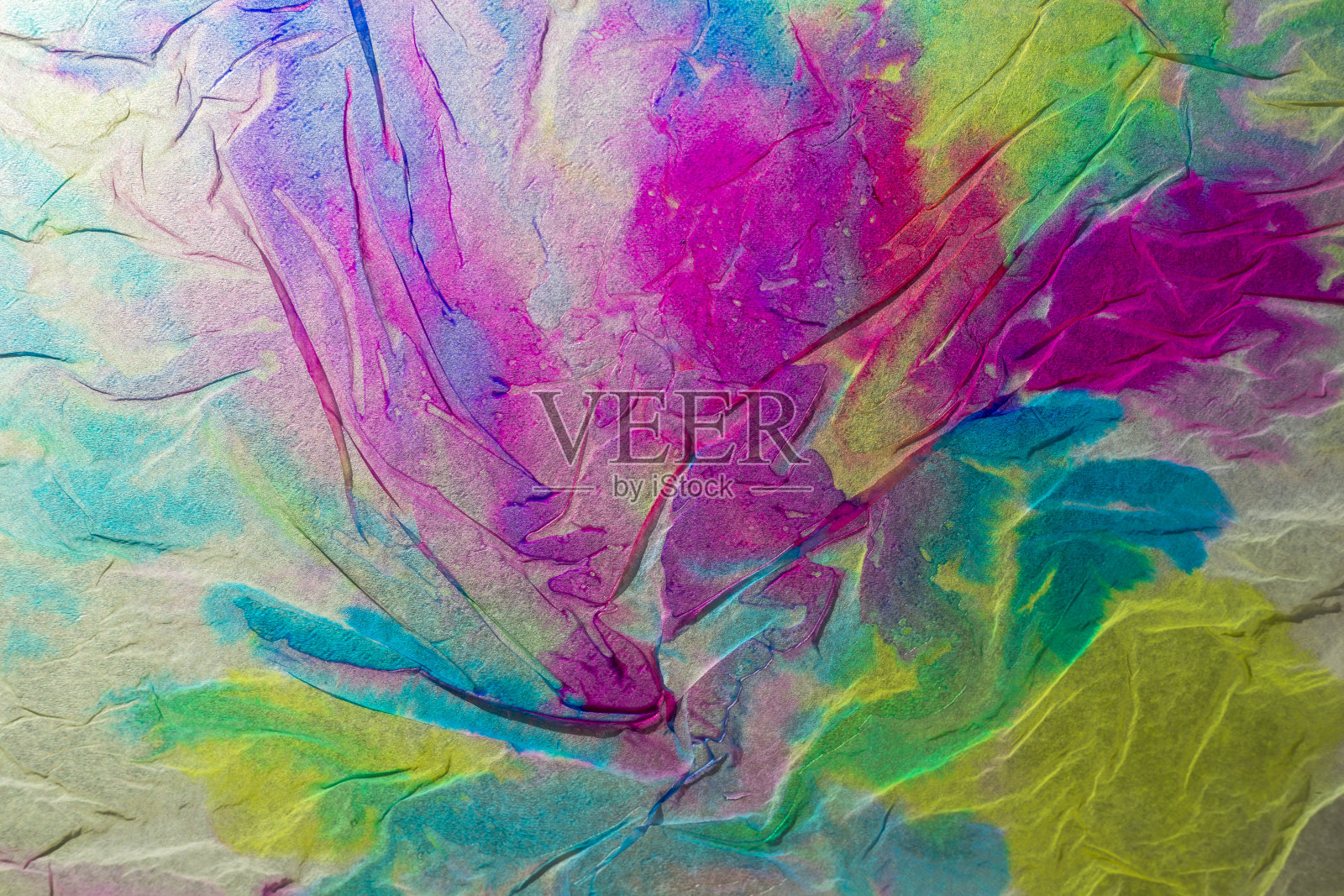 用餐巾纸沾湿彩色液体水彩制作的纹理照片摄影图片