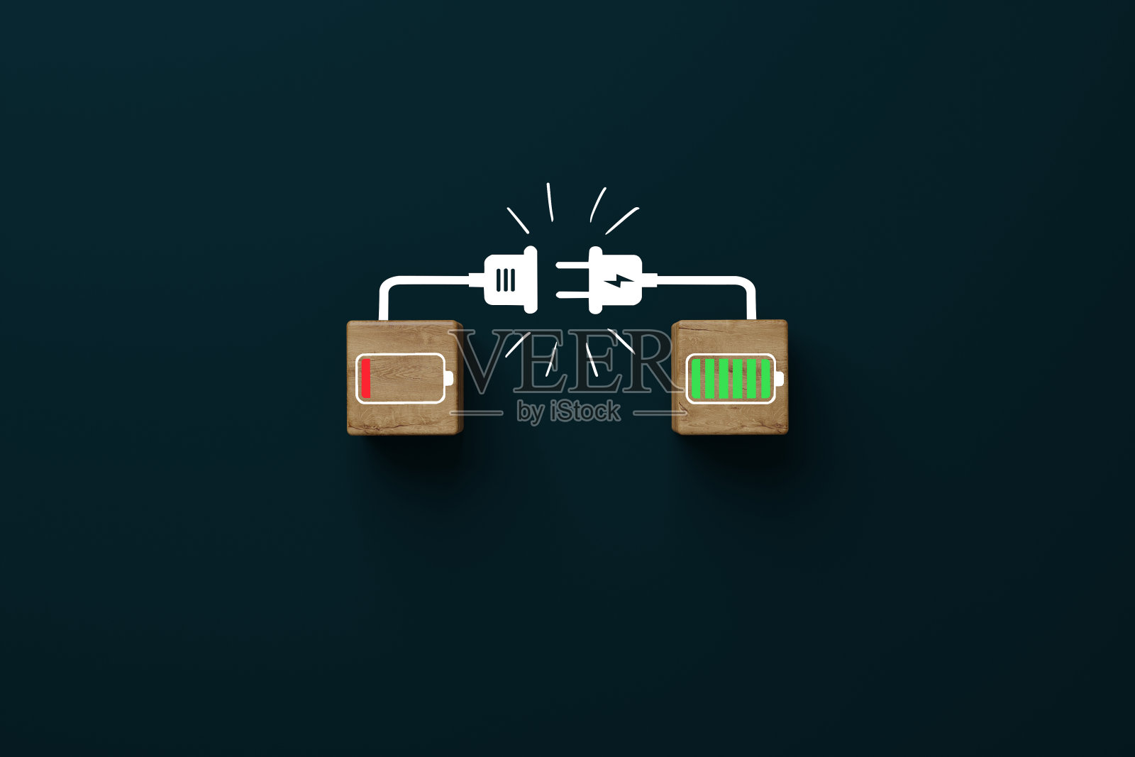 带有可充电电池的木制立方体和另一个立方体。照片摄影图片