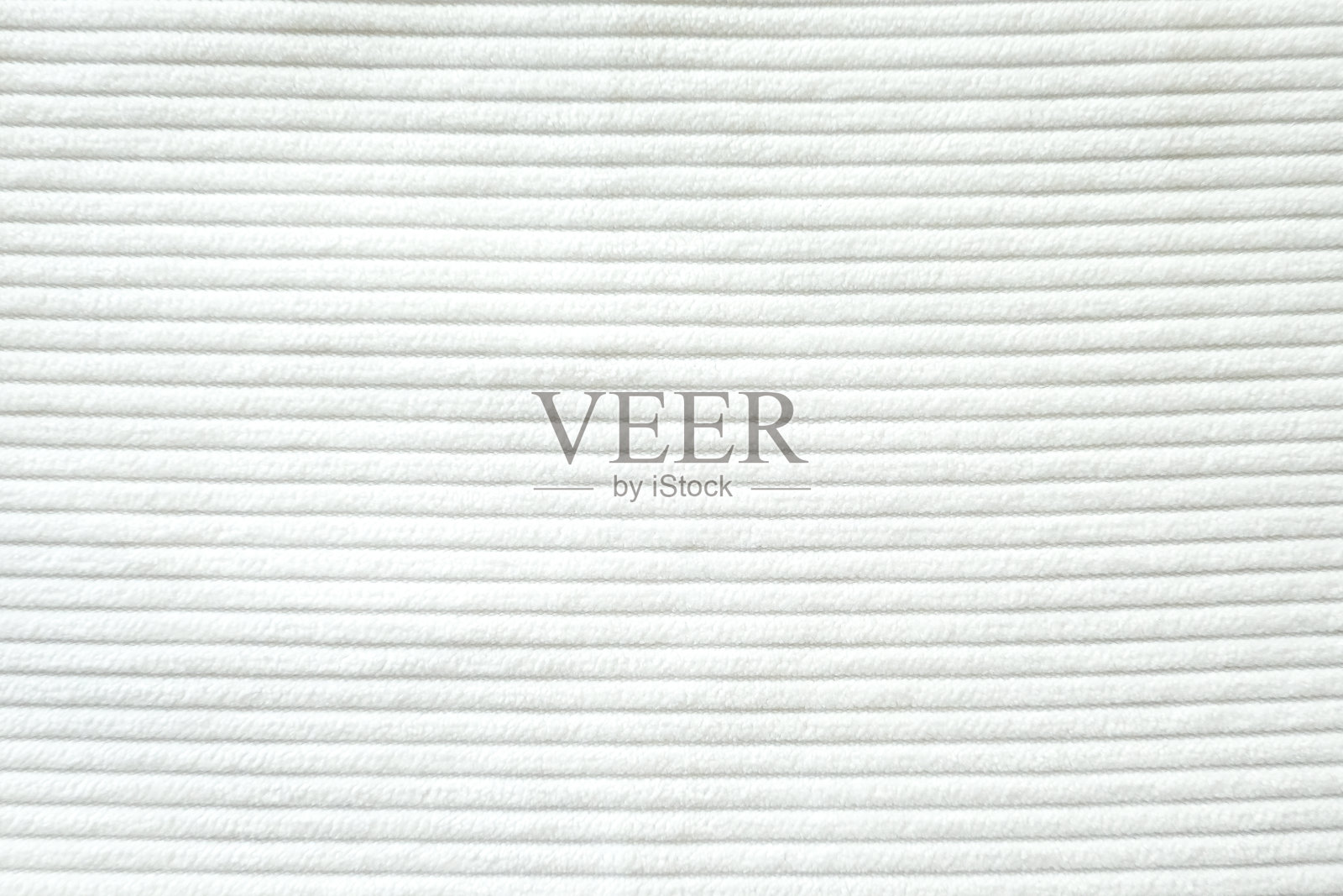 白色灯芯绒图案纹理的背景。照片摄影图片