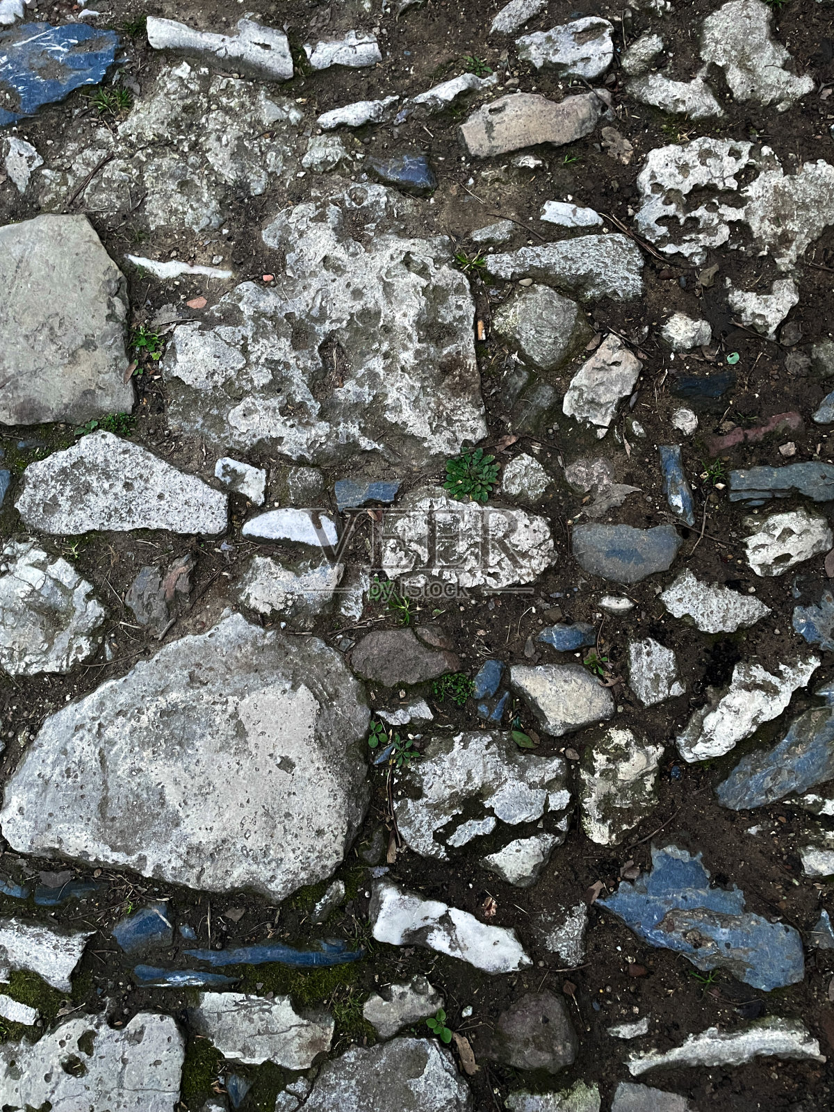 小径的纹理排列着大大小小的石头。背景图像照片摄影图片