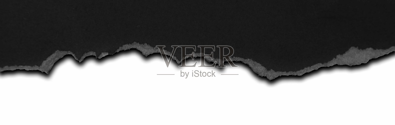 撕黑纸照片摄影图片