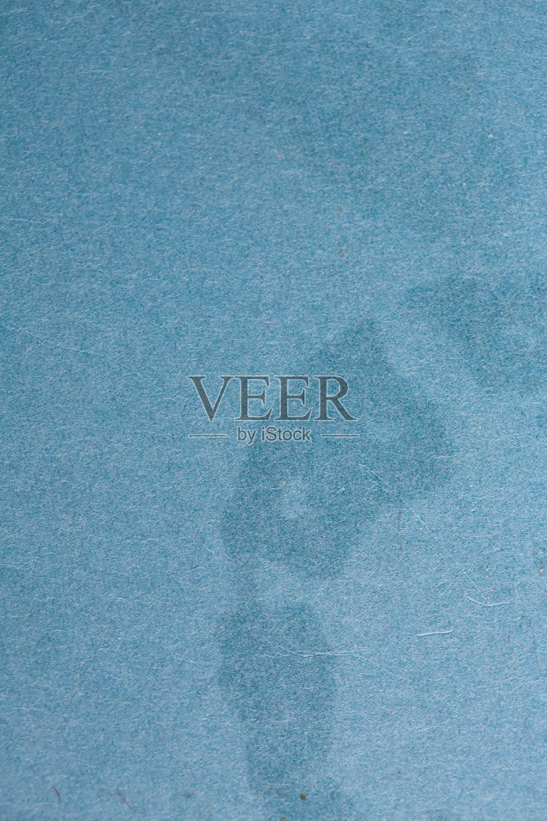 蓝色硬纸板纸的纹理，染色凌乱，背景材料照片摄影图片