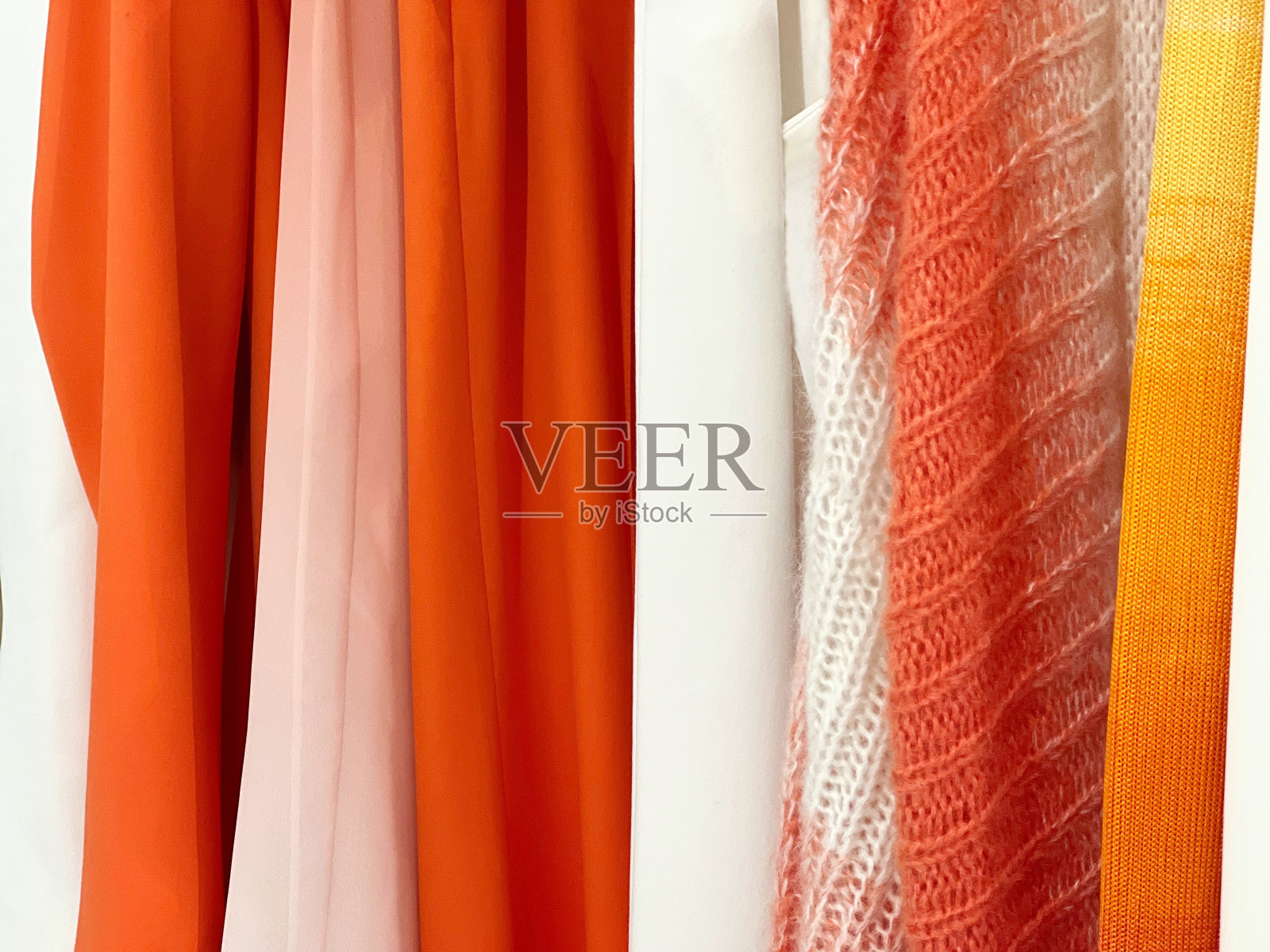 纺织面料白色橙黄色。照片摄影图片