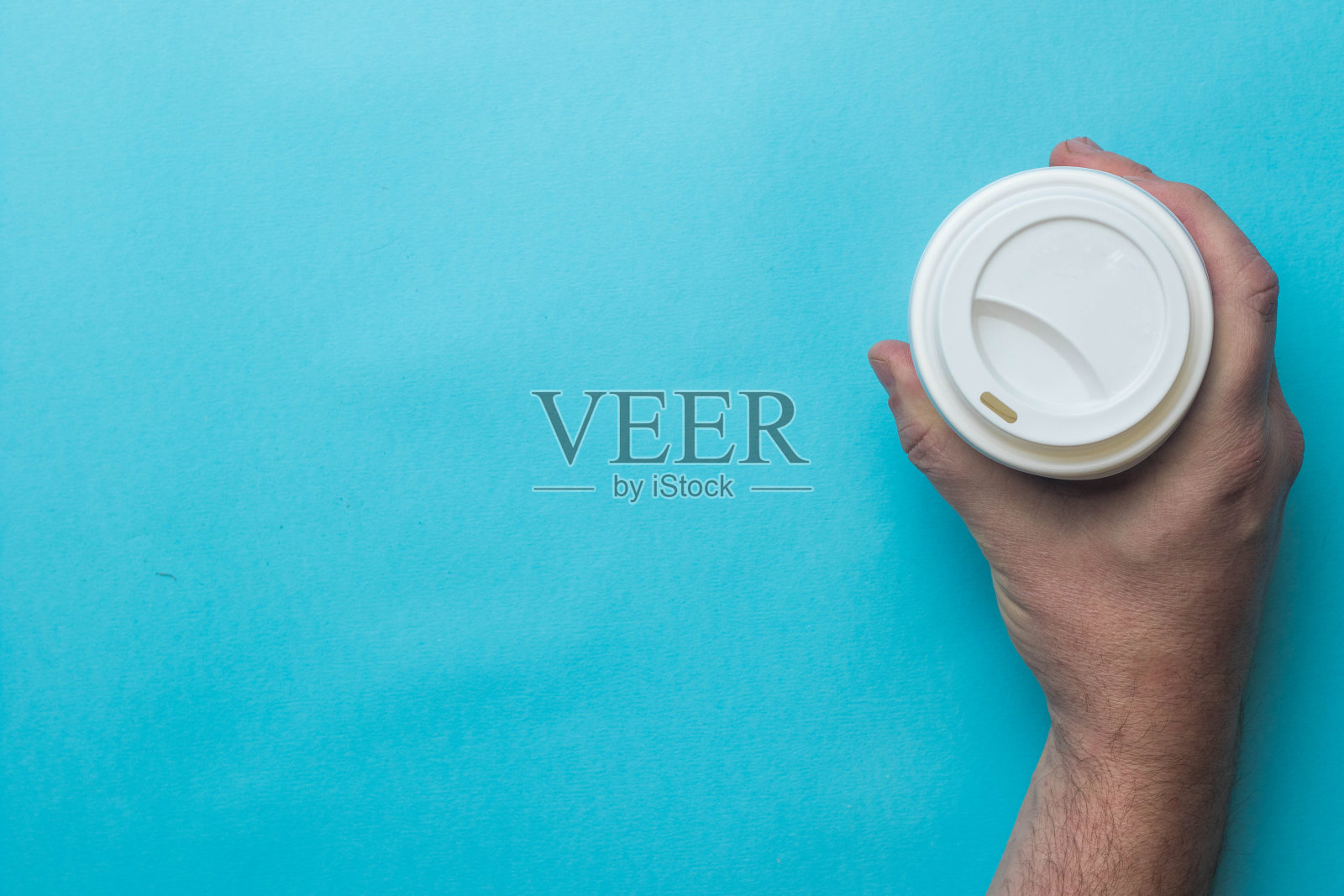 一只手拿着咖啡杯照片摄影图片