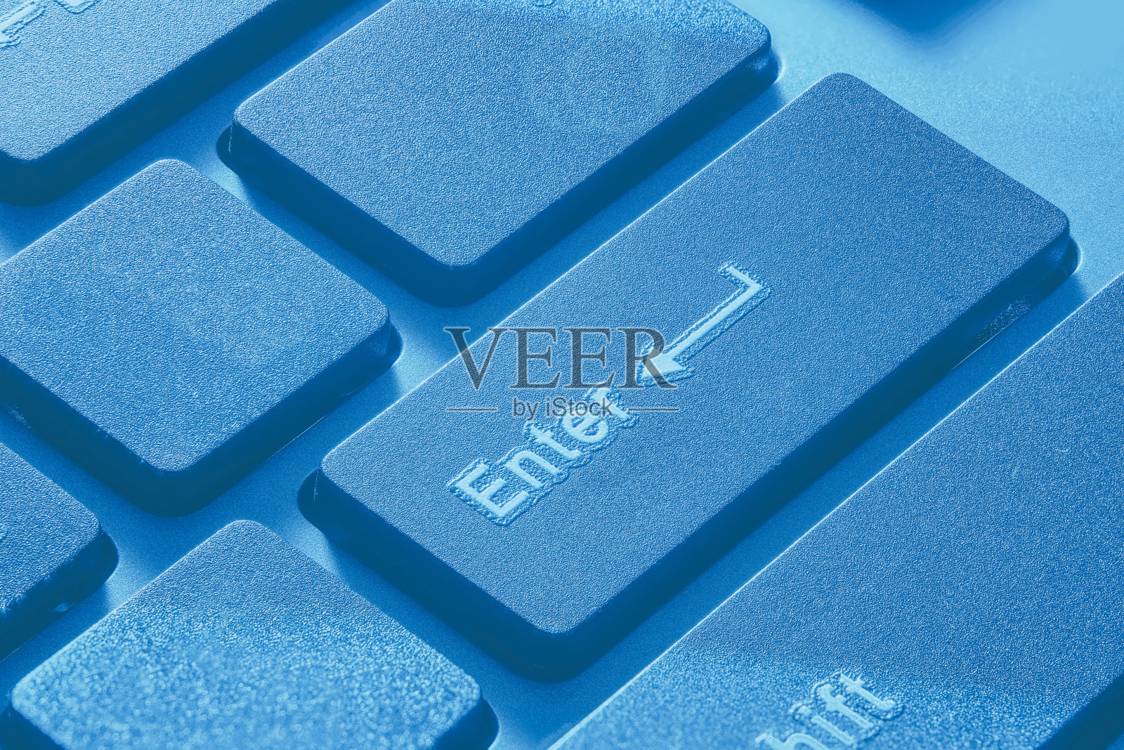 桌面PC键盘上的enter键特写。没有人。照片摄影图片