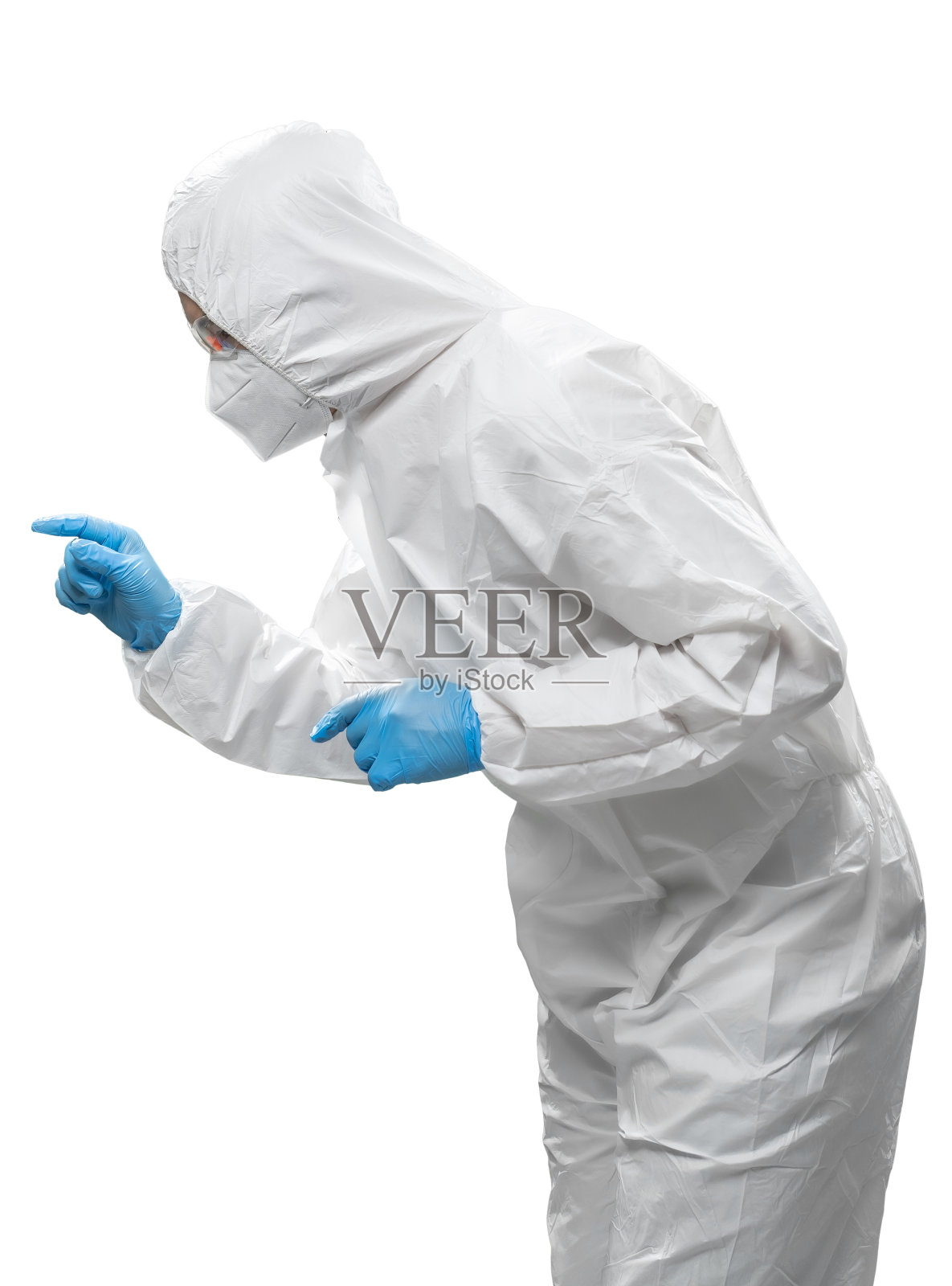 工人穿着医用防护服或白色工作服，配戴口罩和护目镜照片摄影图片