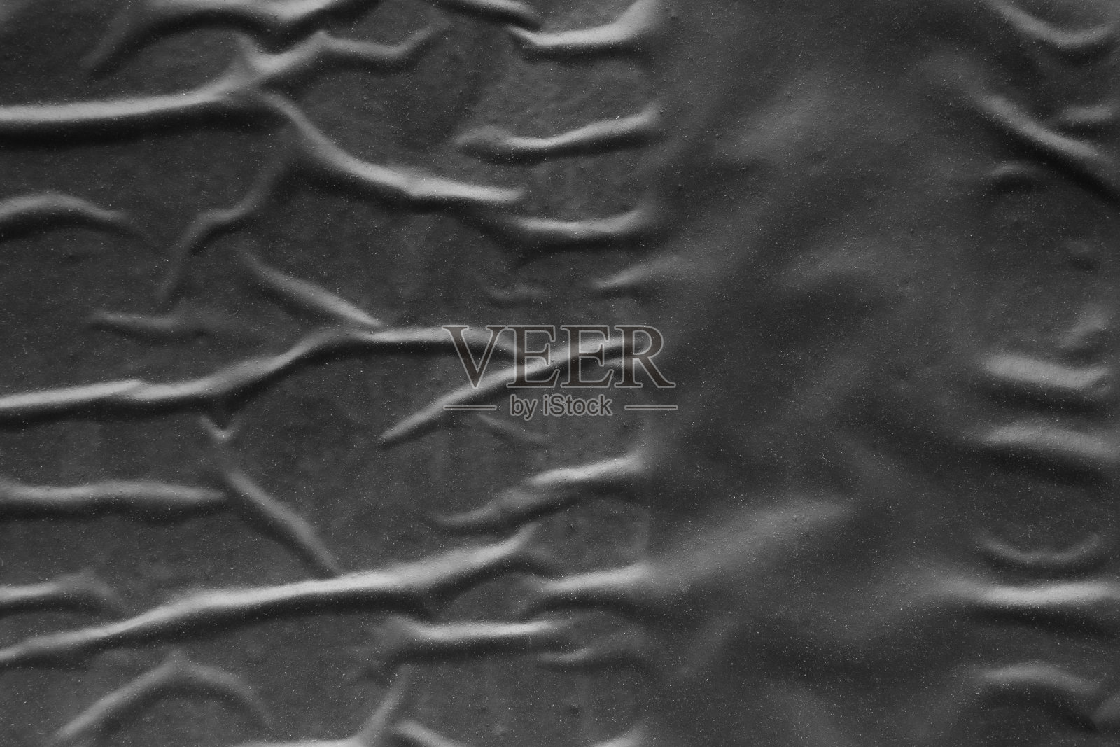 黑色皱褶和折痕塑料海报纹理背景照片摄影图片