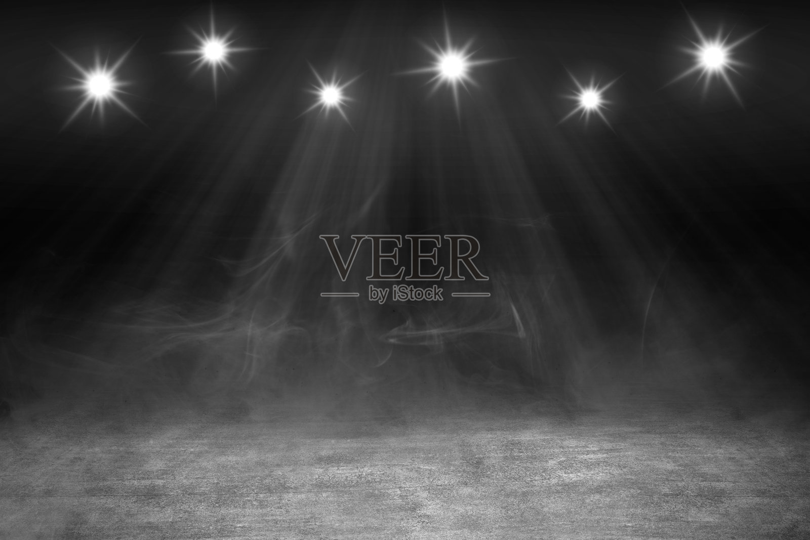 混凝土地板上有白烟和聚光灯照片摄影图片