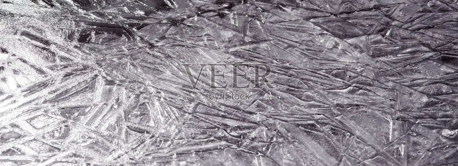 冰表面的纹理。冬天的背景，节日的背景在冰晶的形式，在自然的颜色。照片摄影图片