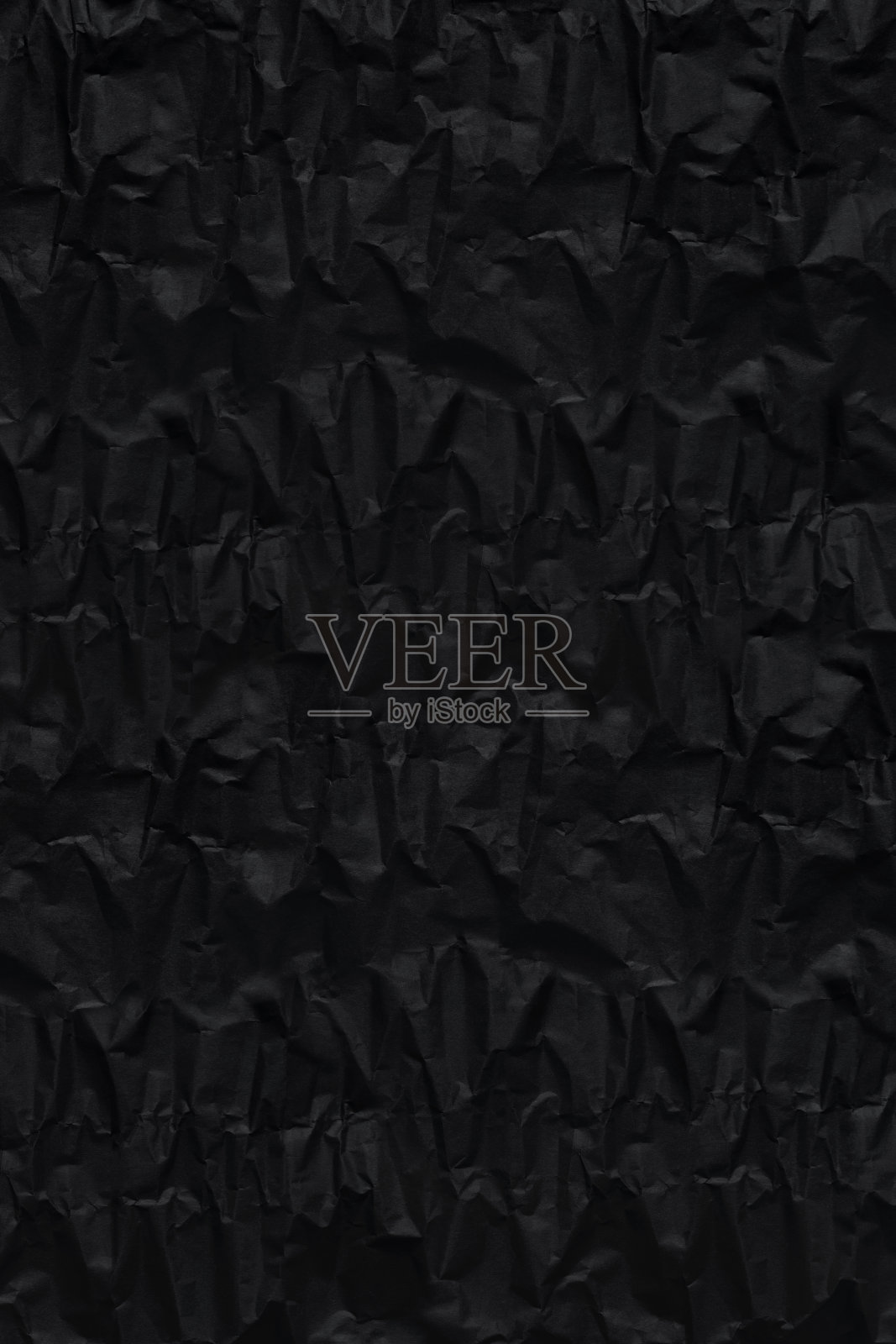 黑色皱褶包装粗糙的纸图案为背景照片摄影图片