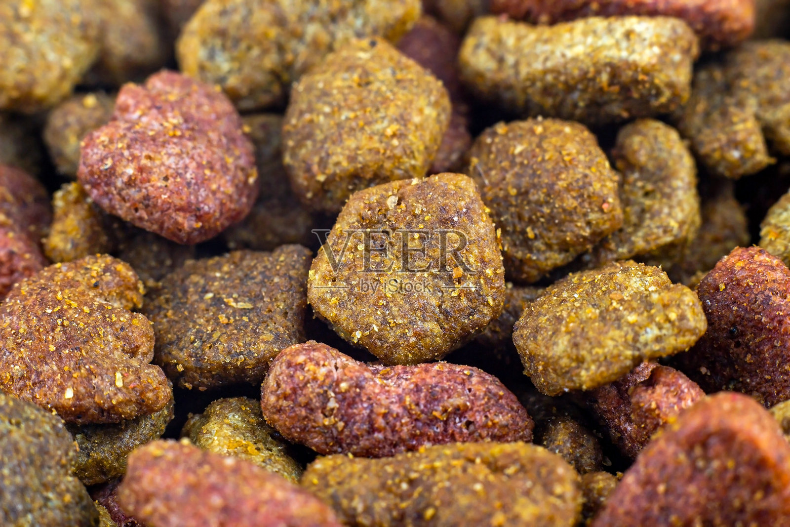 棕色的干猫粮作为一个纹理图案接近照片摄影图片