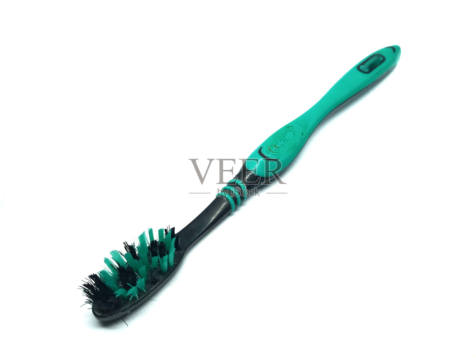 白色背景上的破牙刷照片摄影图片