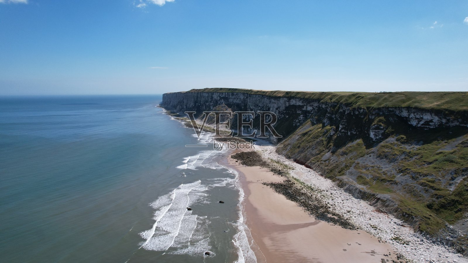 樱草谷悬崖边，美丽的海滩照片摄影图片