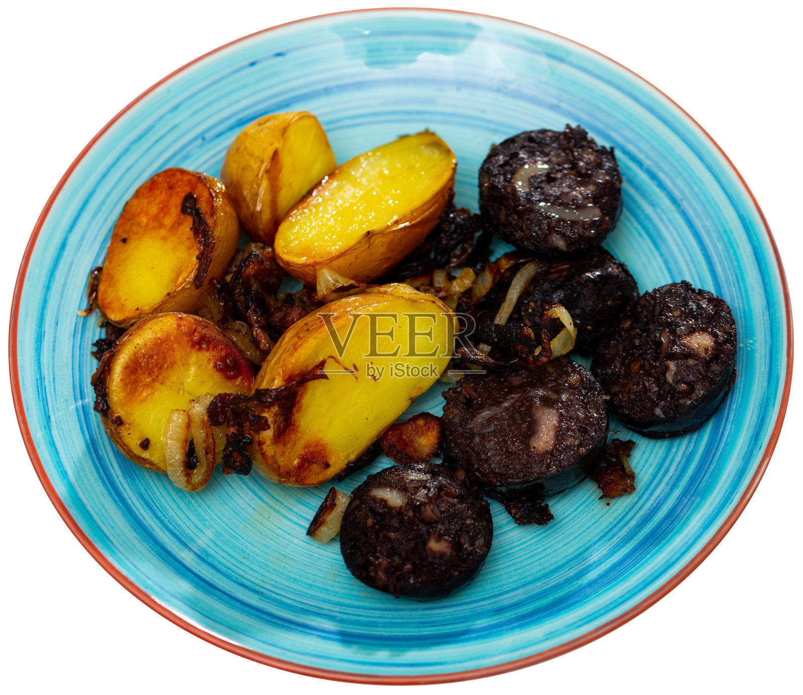 脆皮黑布丁，配上带皮的烤土豆照片摄影图片