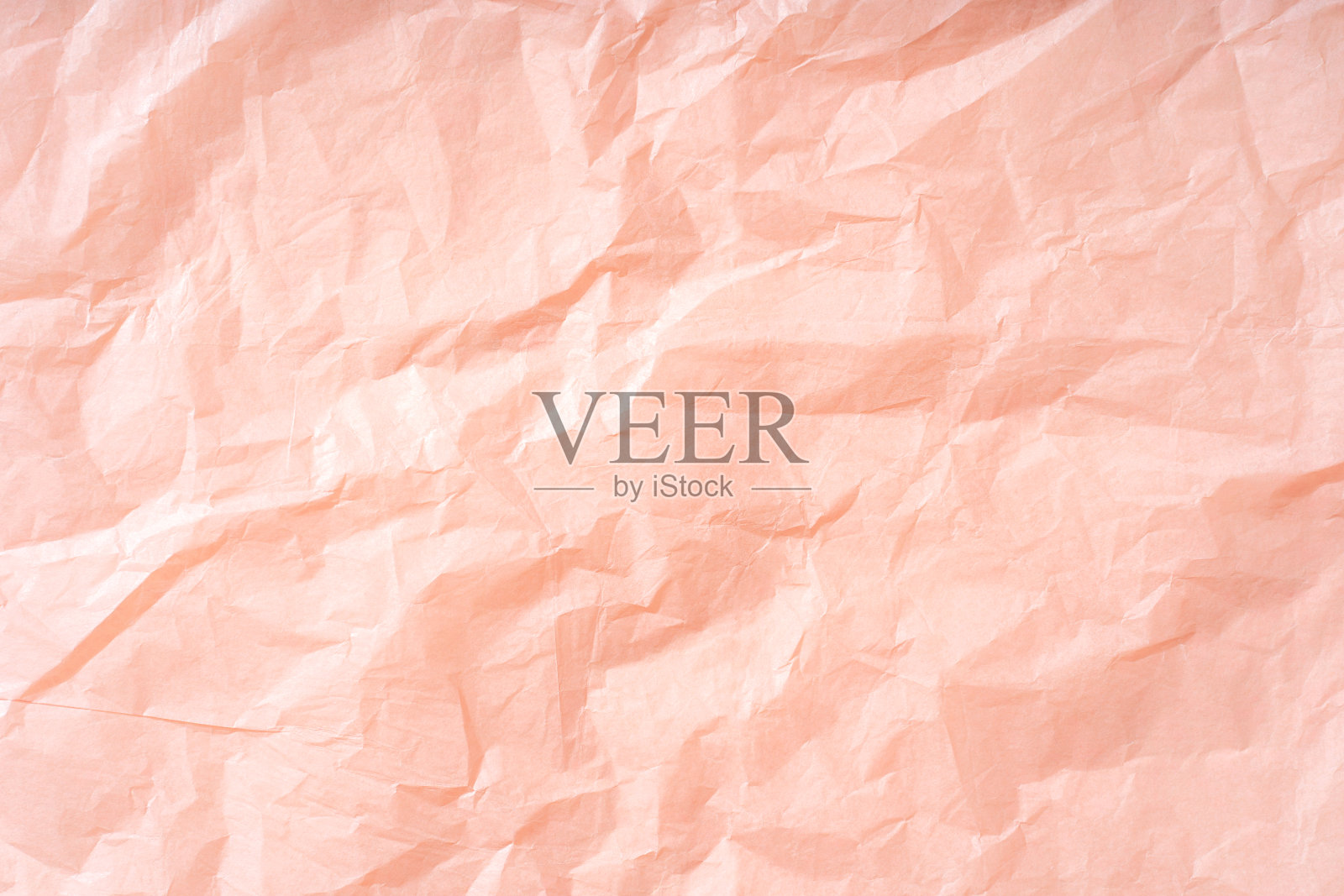 粉红色背景包装纸与皱的纹理。你的设计背景。照片摄影图片