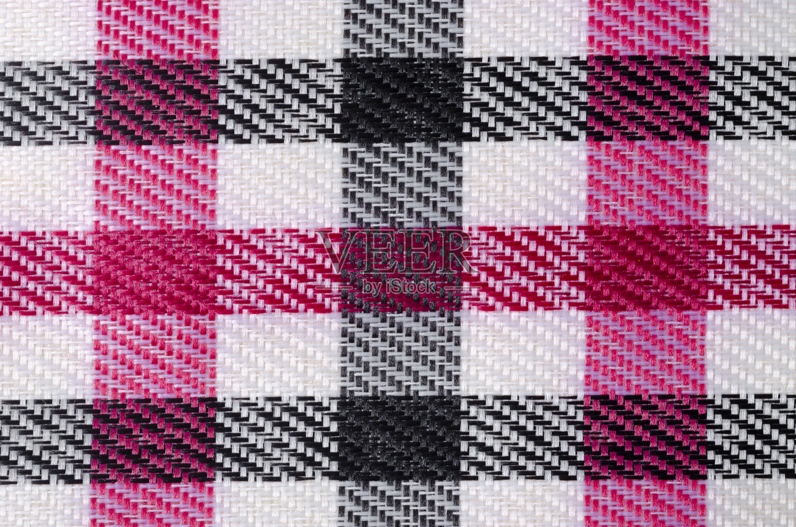粉红色和黑色格纹织物纹理为背景。照片摄影图片