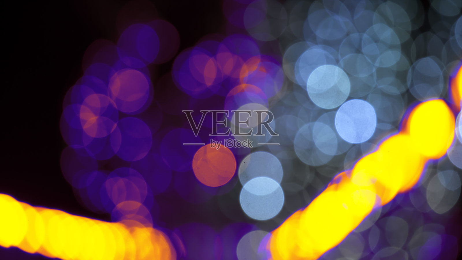 背景模糊抽象的彩灯和装饰。街道彩灯的散景纹理照片摄影图片