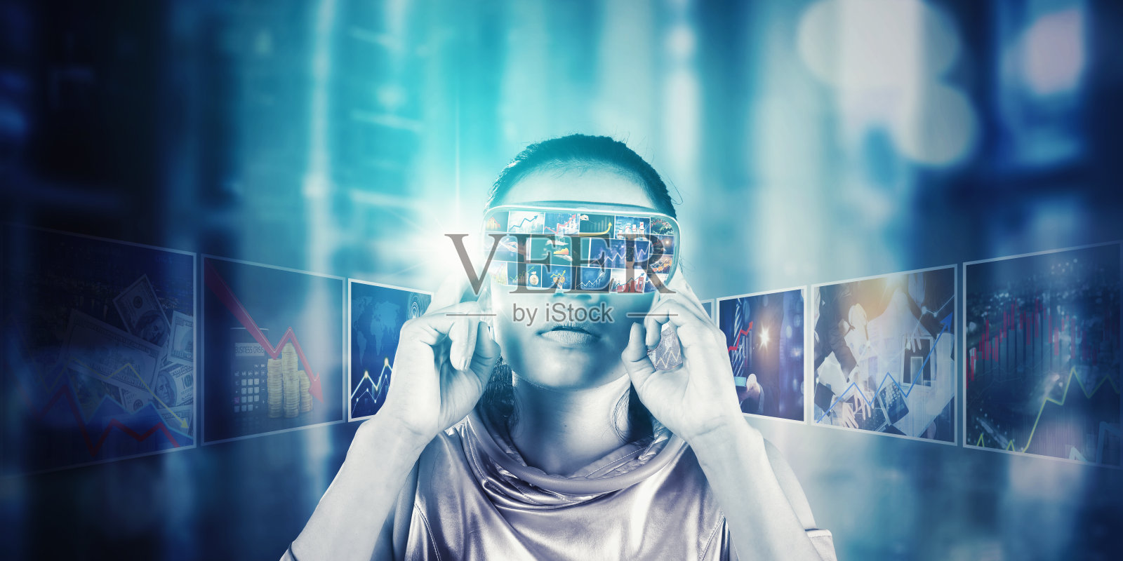 女人戴着虚拟现实眼镜看金融市场图表照片摄影图片