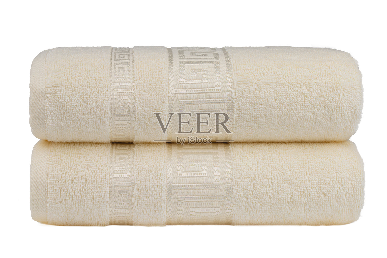 五颜六色的毛巾，卷起来堆放在桌子上照片摄影图片