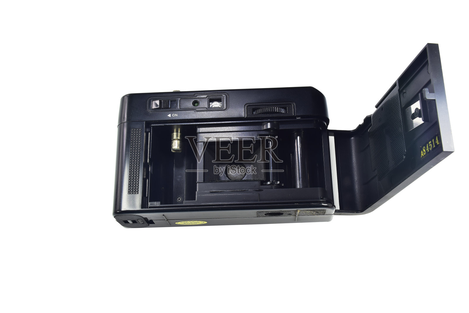 一个老式胶片的特写，在相机内35mm。1 3.8隔离在白色背景上。825照片摄影图片