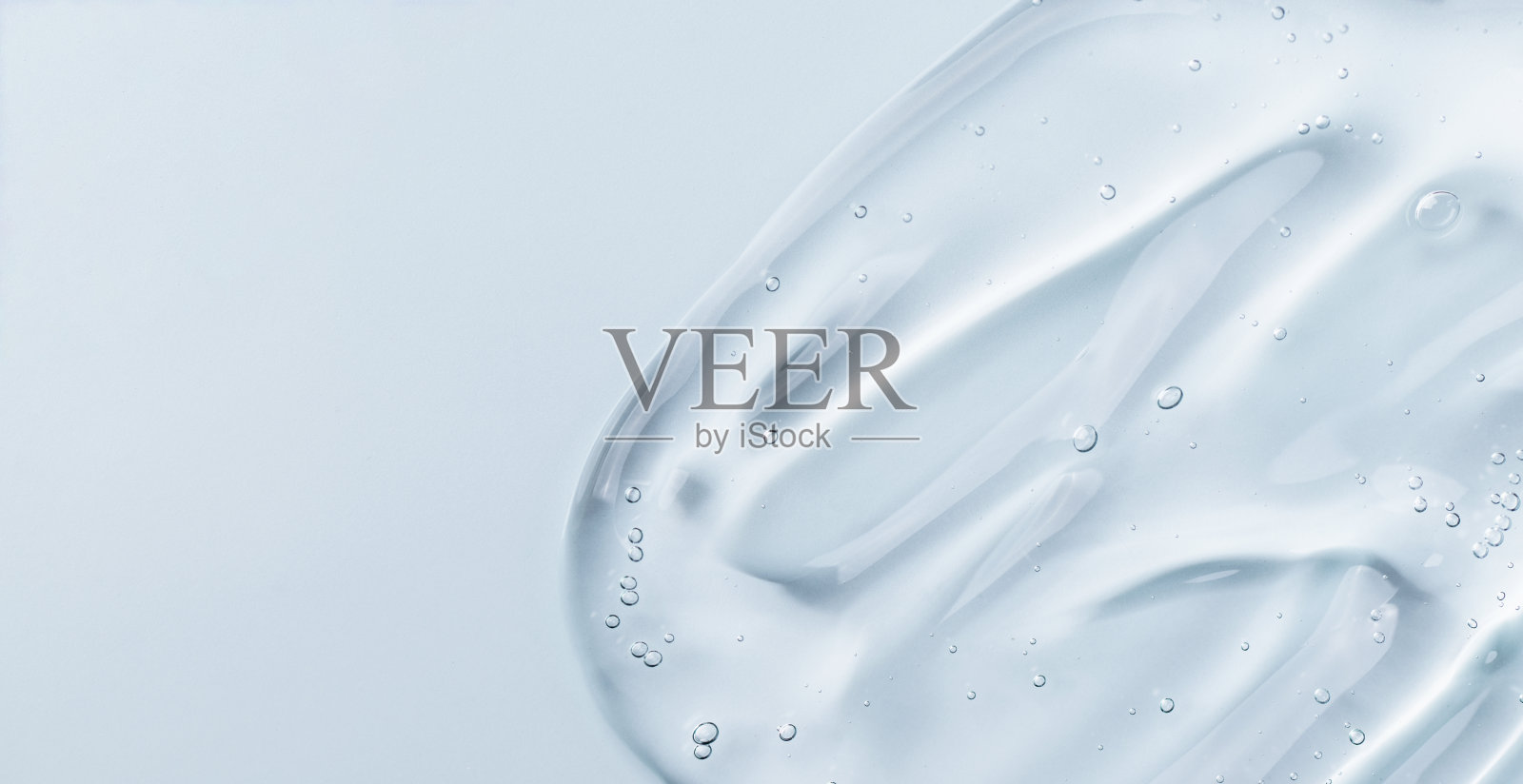 血清凝胶涂片在蓝色背景。照片摄影图片