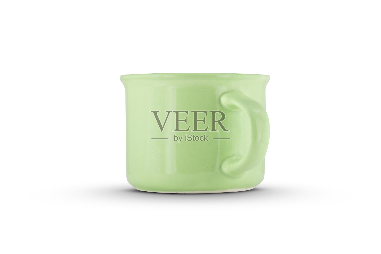 白色背景上的绿色陶瓷杯照片摄影图片