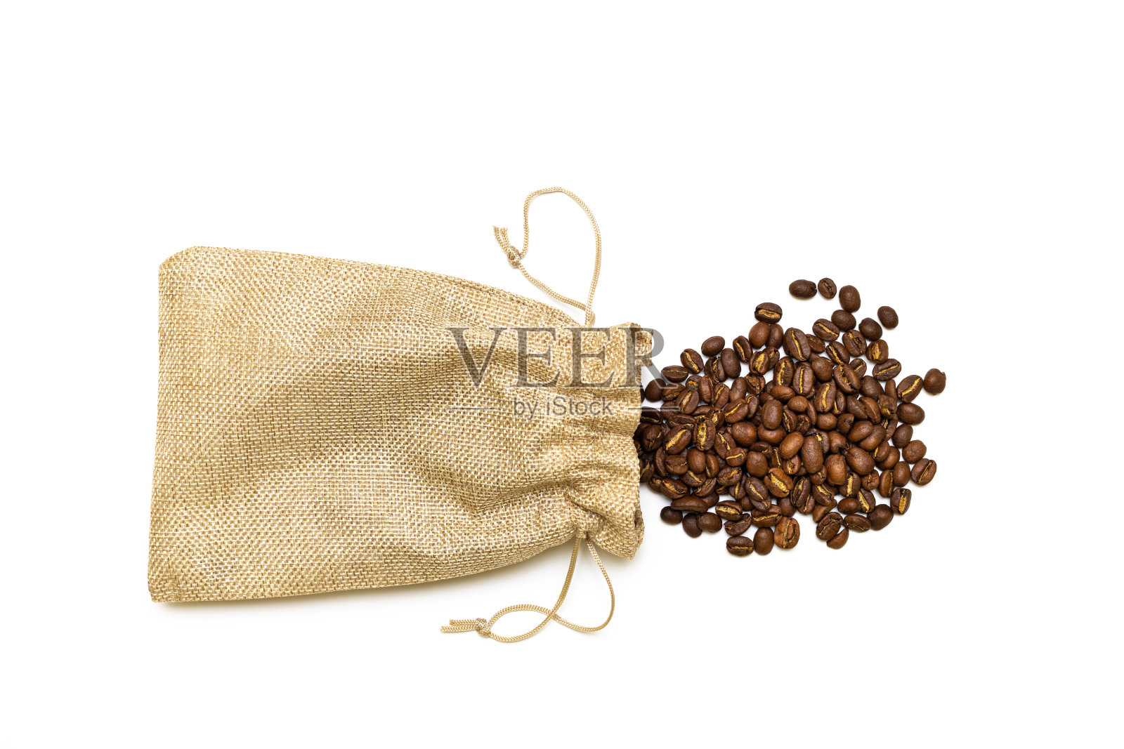 白底帆布袋里的咖啡豆。照片摄影图片