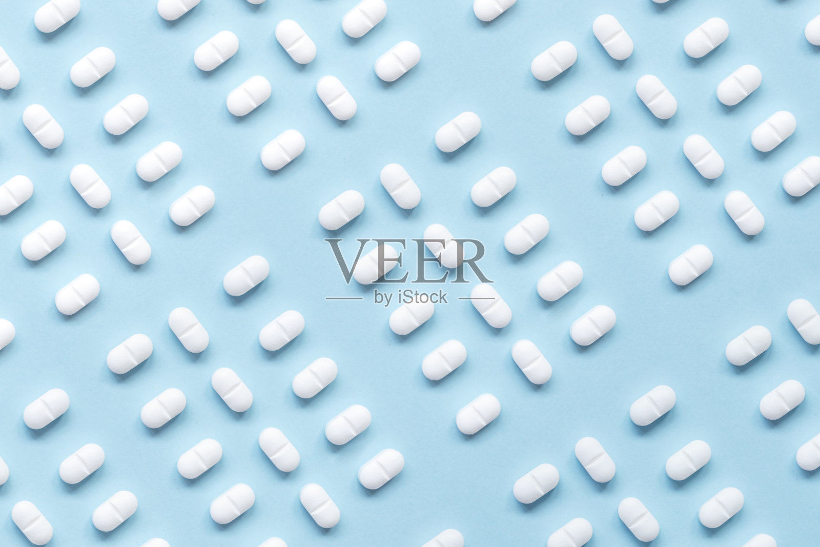 蓝色背景药丸照片摄影图片