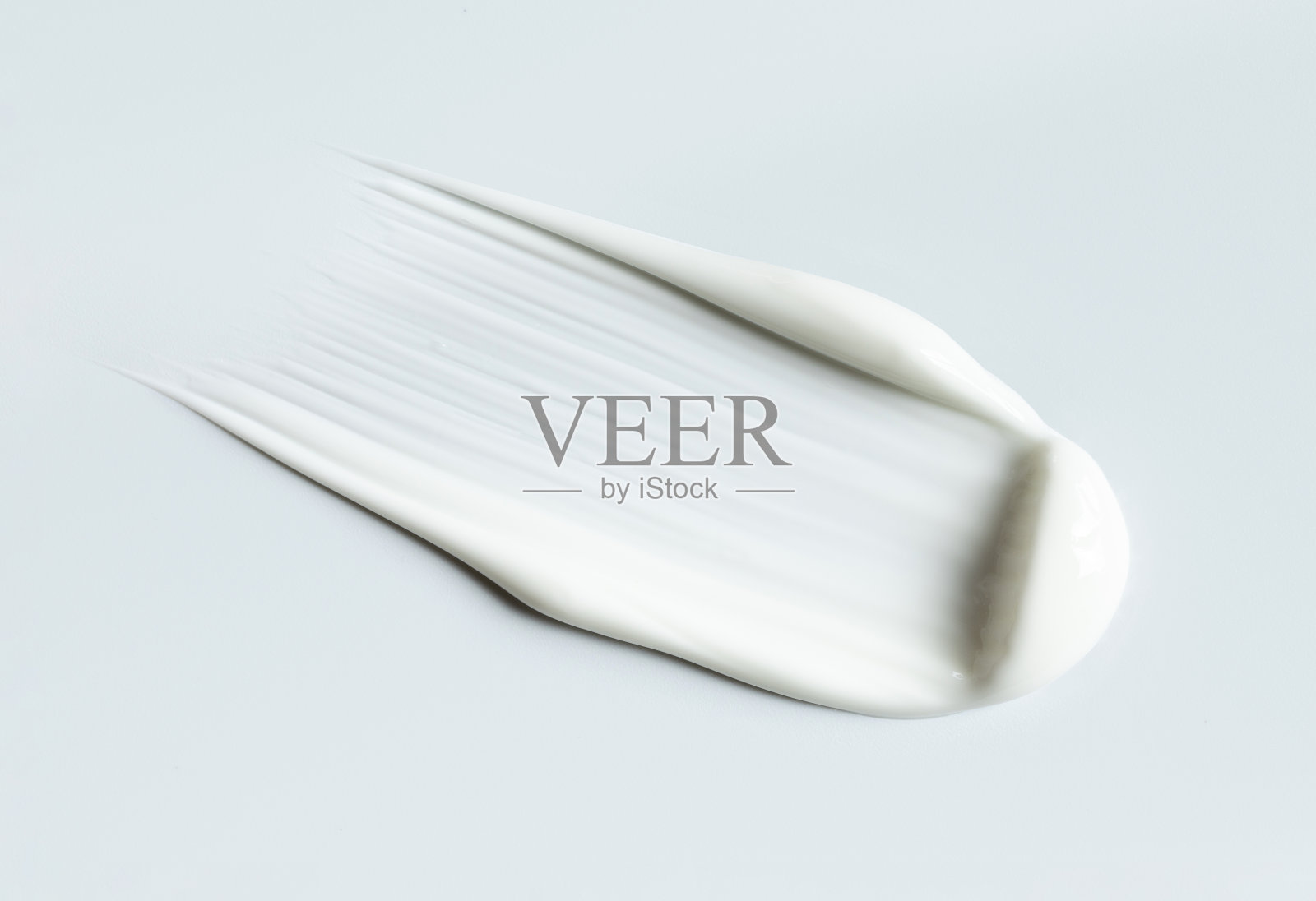 灰色背景上奶油质地的化妆品涂抹照片摄影图片