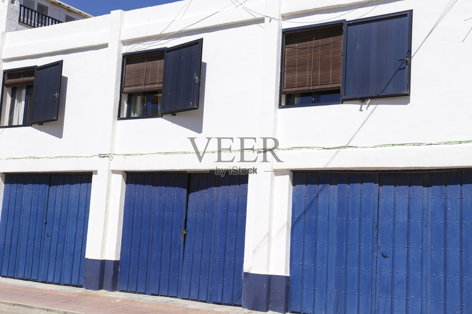 卡波德帕洛斯村岸边粉刷过的房子照片摄影图片