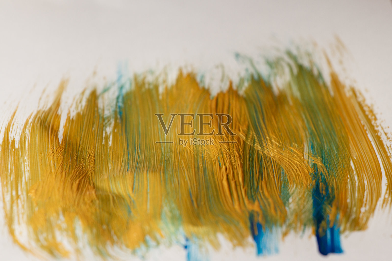 在一张纸上画上金色和蓝色的线条，抽象。照片摄影图片