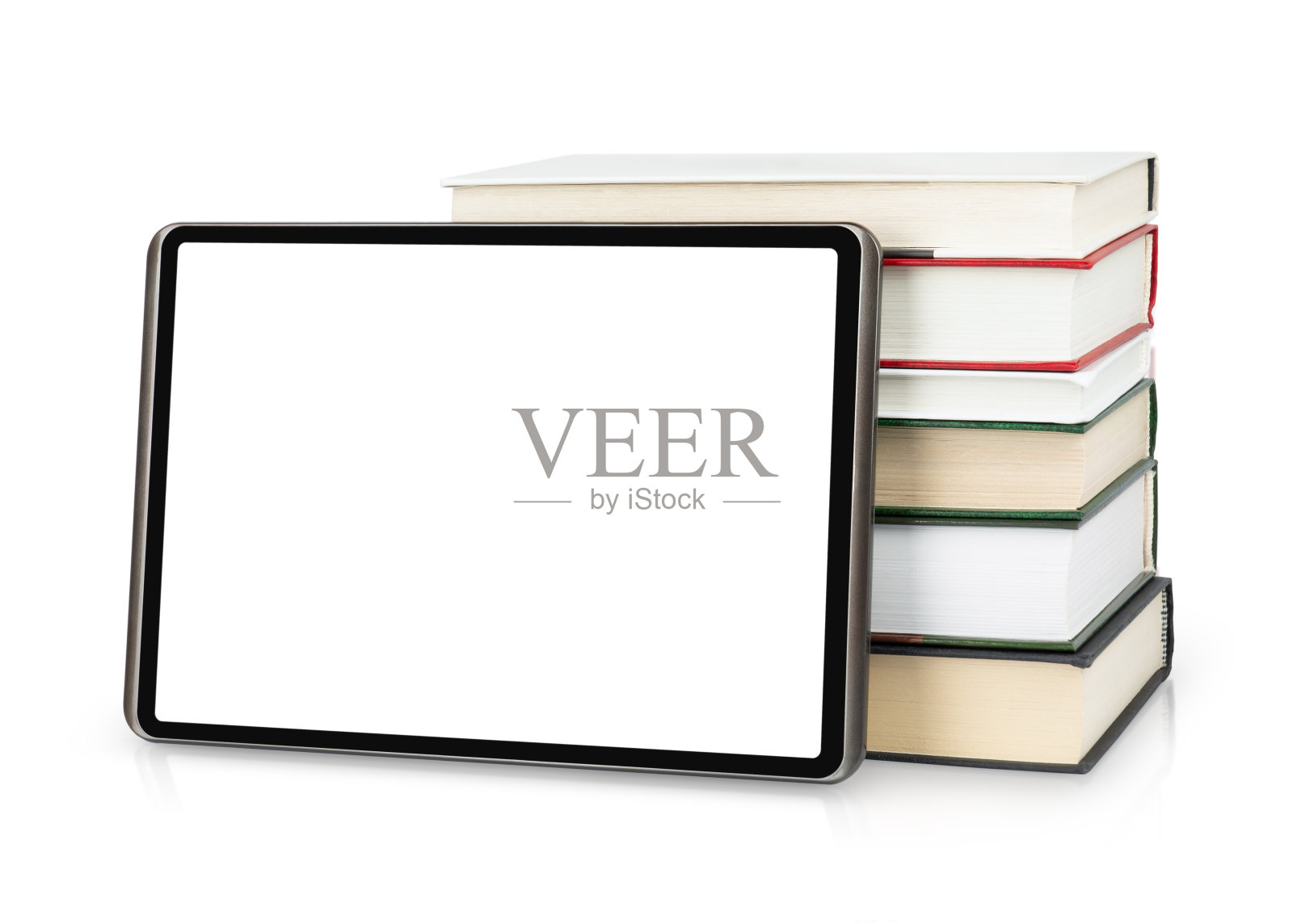 数字平板电脑与书籍隔离在白色照片摄影图片