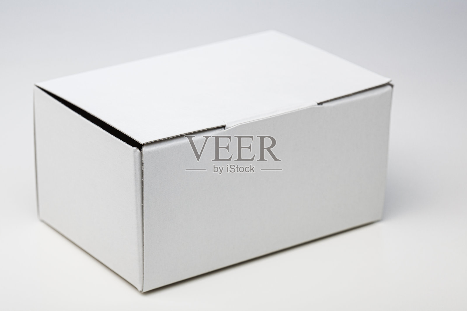 白色纸板箱。小型可回收容器。照片摄影图片