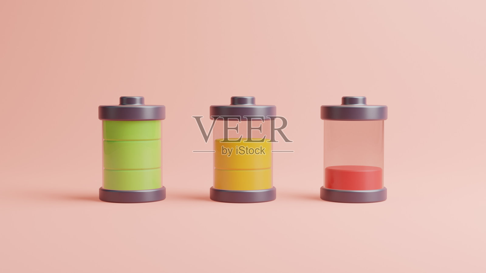 淡粉色背景上的三块不同充电能量的电池照片摄影图片